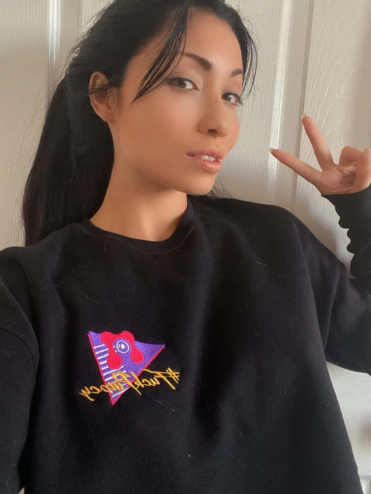 Rina Ellis in a black Cam Model Protection sweater